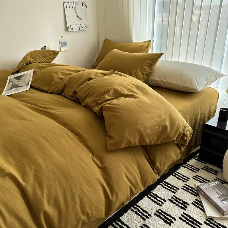 Warm mustard-colored cotton bedding set with soft textured fabric and matching pillows from decorbites luxurious collection