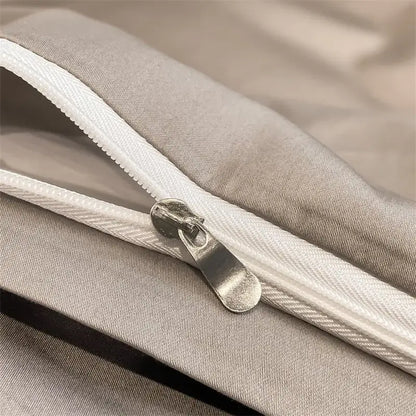 Silver zipper with metallic pull tab on light gray seam of decorbites™ 1000tc egyptian cotton duvet cover