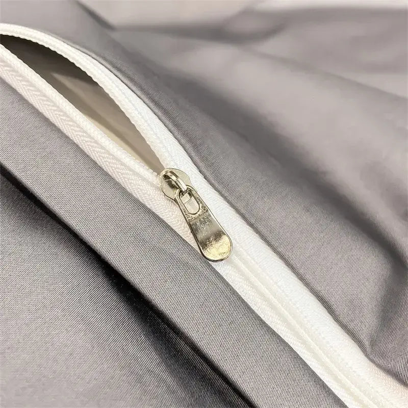 Silver-toned zipper with metallic pull tab on soft gray egyptian cotton duvet cover from decorbites luxurious bedding set