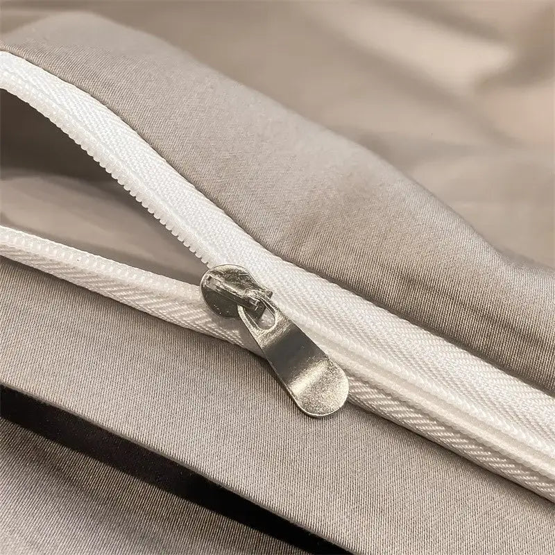 Silver zipper with metallic pull tab on light gray egyptian cotton duvet cover from decorbites luxurious bedding set