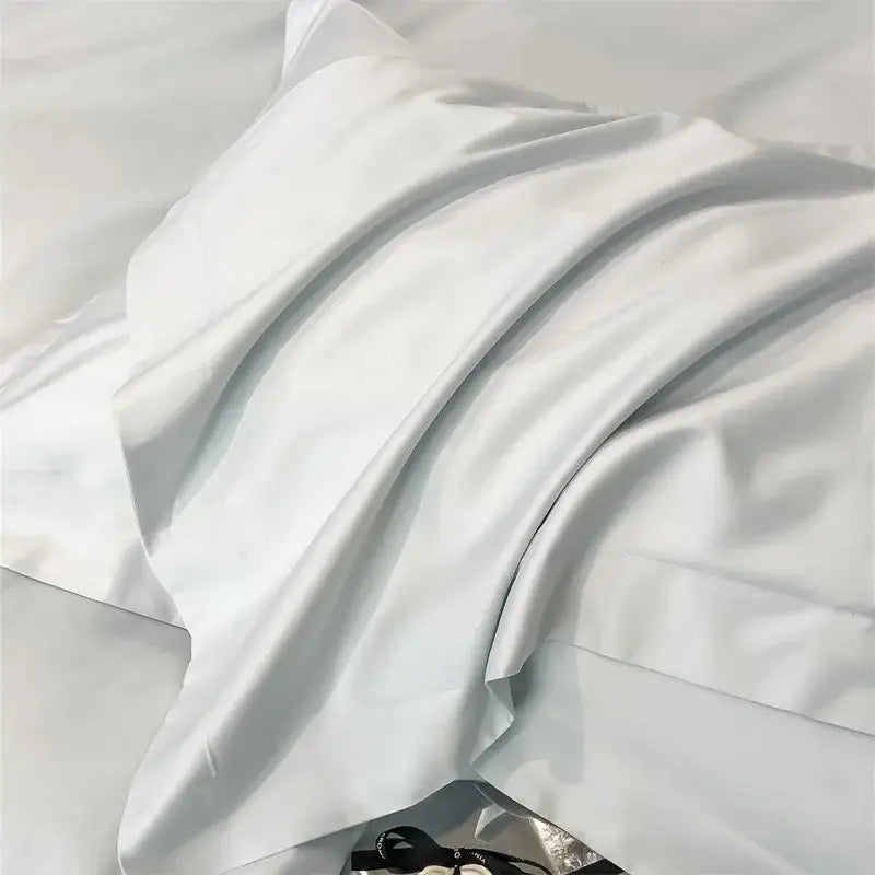 A smooth white satin pillowcase from decorbites™ luxurious egyptian cotton bedding set 1000tc with sheen folds