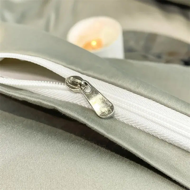 Silver-toned zipper pull on light gray satin fabric of decorbites™ luxurious egyptian cotton duvet cover 1000tc ultra soft