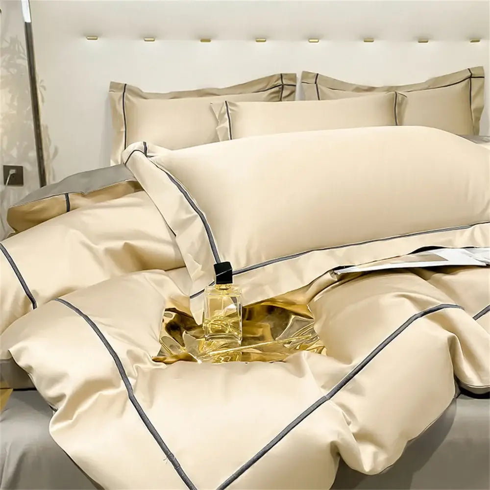 Cream-colored satin egyptian cotton bedding set with elegant black piping accents including a duvet cover