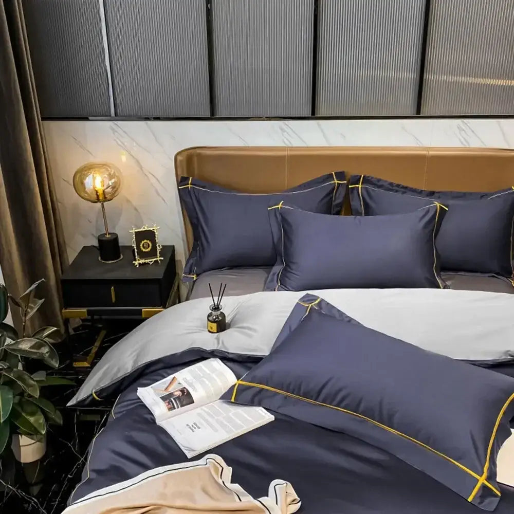 Navy blue satin pillowcases with gold piping detail from decorbites luxurious egyptian cotton embroidered bedding set