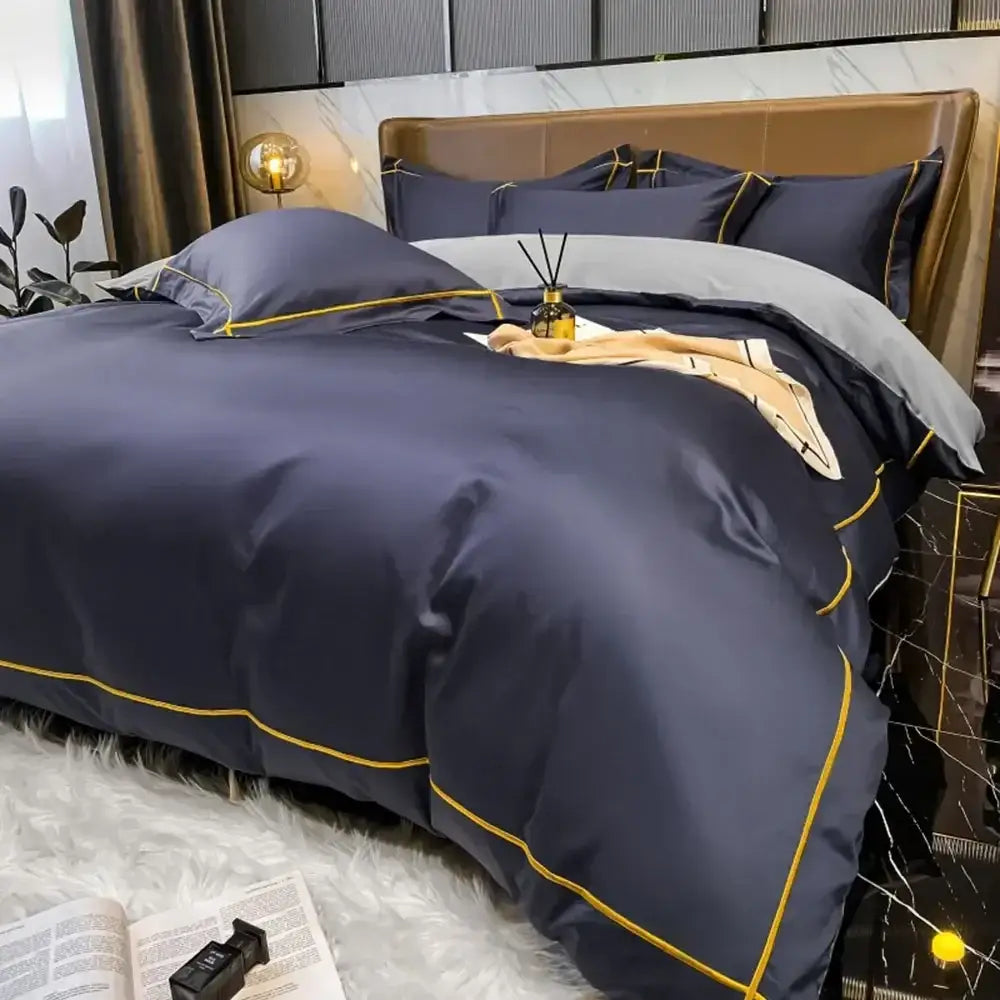 Navy blue satin egyptian cotton duvet cover and pillowcases with gold piping in DecorBites™ luxurious bedding set