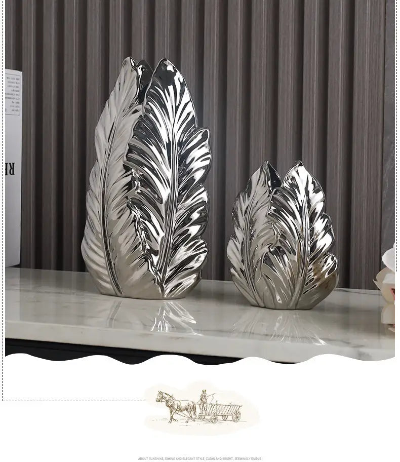 Shiny silver ceramic leaf sculptures with detailed veining complement DecorBites™ luxurious gold ceramic vases for home decor