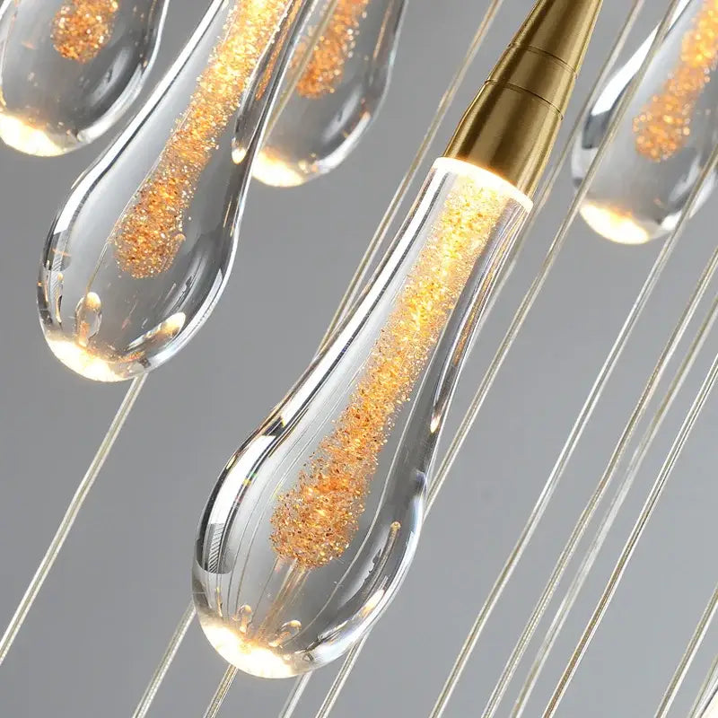 DecorBites™ luxurious gold crystal chandelier with clear glass teardrop pendant lights and brass-finished tops for staircase use