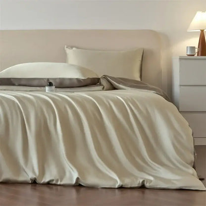 Cream-colored satin duvet cover with subtle sheen and matching pillowcases from decorbites luxurious lyocell silk bedding set