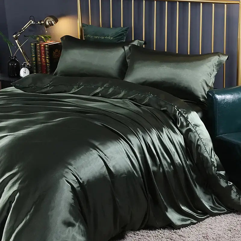 Dark green satin duvet cover and bed sheet bedding set with glossy smooth texture and elegant draping by decorbites