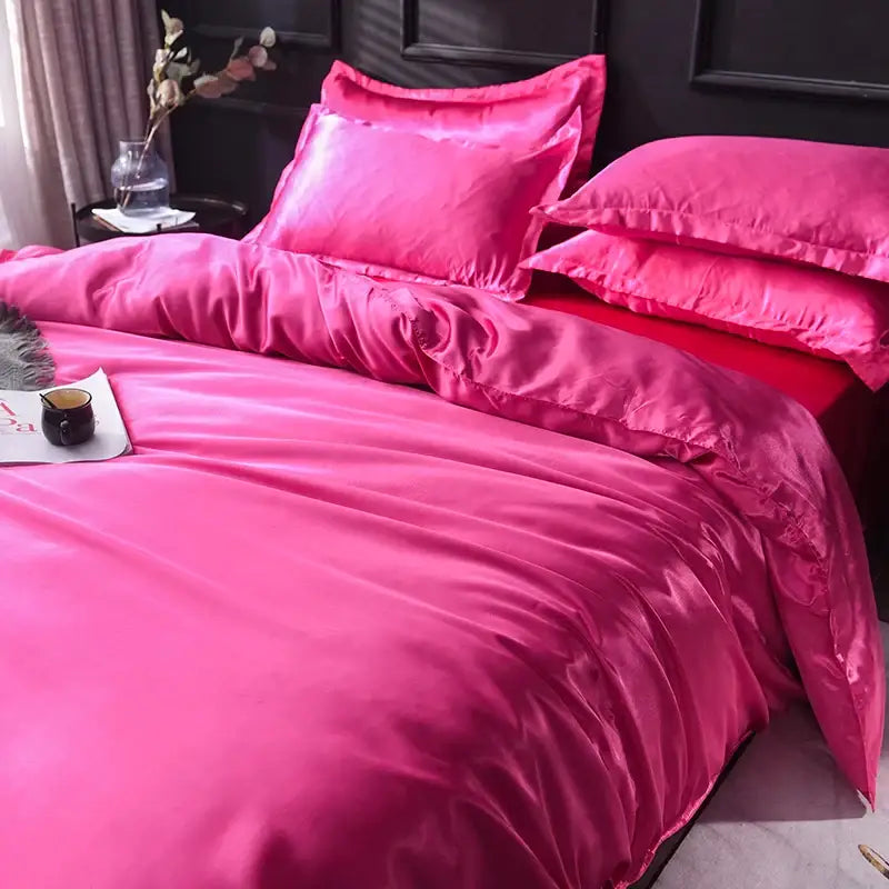 Vibrant fuchsia satin bedding set with glossy smooth texture and matching pillowcases from decorbites luxurious silk bedding set