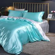 Turquoise satin duvet cover set with pcs duvet cover and matching pillowcases featuring luxurious sheen by DecorBites