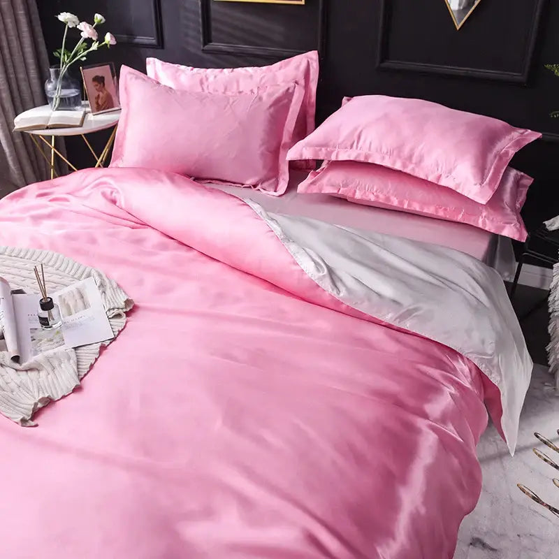 DecorBites™ luxurious silk bedding set in pink satin with subtle sheen and contrasting silver inner lining pillowcases