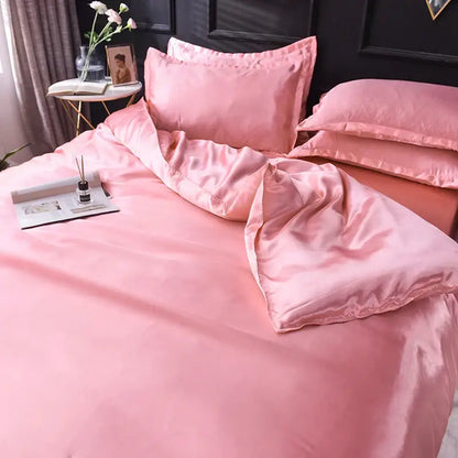 Pink satin silk bedding set by decorbites featuring smooth glossy finish bed sheet and matching duvet cover