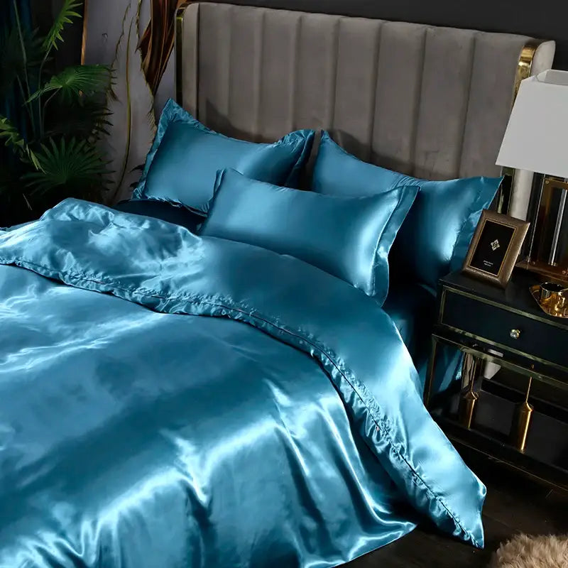 Teal satin silk bedding set with a glossy finish and matching pillowcases from DecorBites luxurious silk bedding set