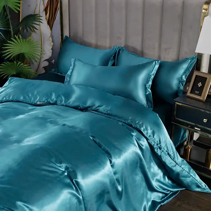 Decorbites™ luxurious silk bedding set in teal satin with a glossy smooth texture and matching pillowcases