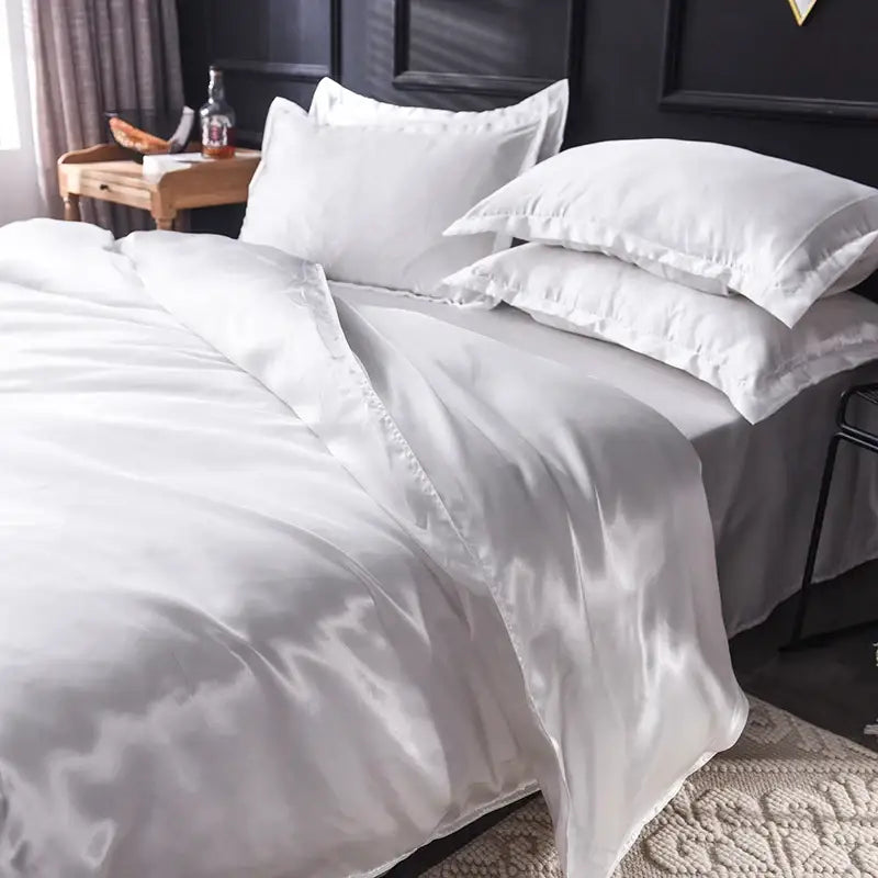 DecorBites™ luxurious silk bedding set featuring a white satin duvet cover and matching pillowcases with glossy finish