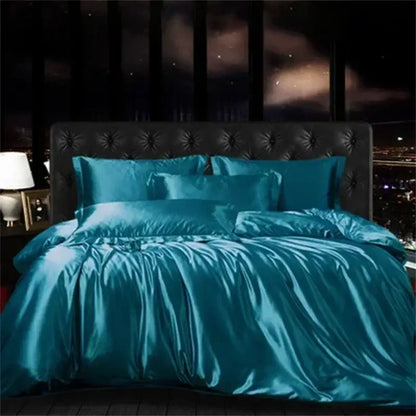Teal satin duvet cover and pillows with tufted headboard in DecorBites™ luxurious mulberry silk bedding set