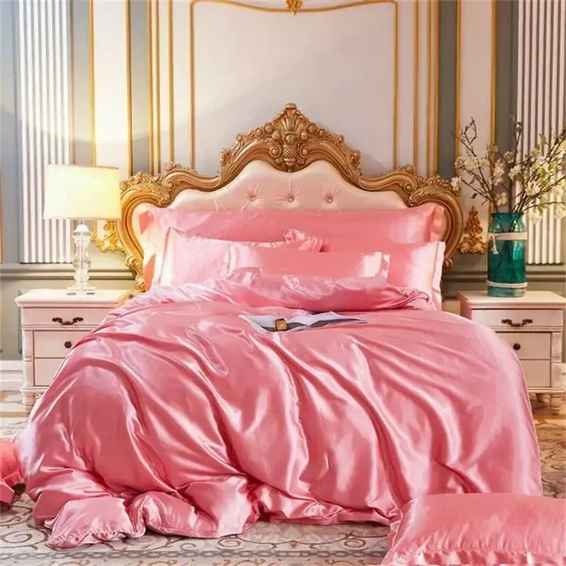 Pink satin bedding set with duvet cover and pcs fitted sheet featuring ornate gold headboard for king and queen sizes