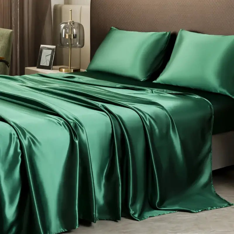 Emerald green satin bedding set with solid color flat sheet and matching pillowcases by DecorBites™