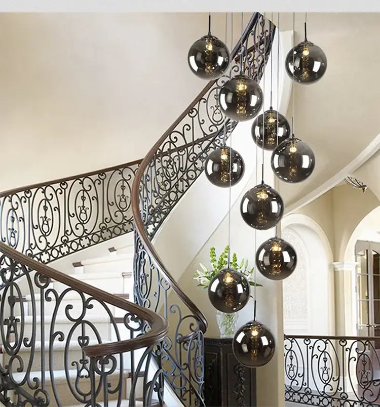 A set of sleek dark glass globe pendant lights in the DecorBites luxurious spiral led modern loft chandelier
