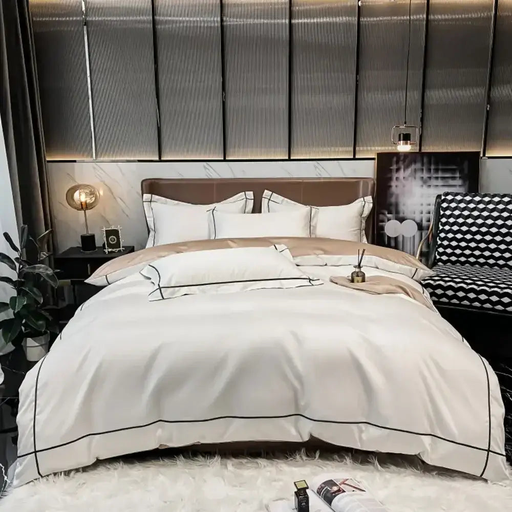 Cream-colored satin duvet cover with black piping trim in DecorBites™ luxurious egyptian cotton bedding set