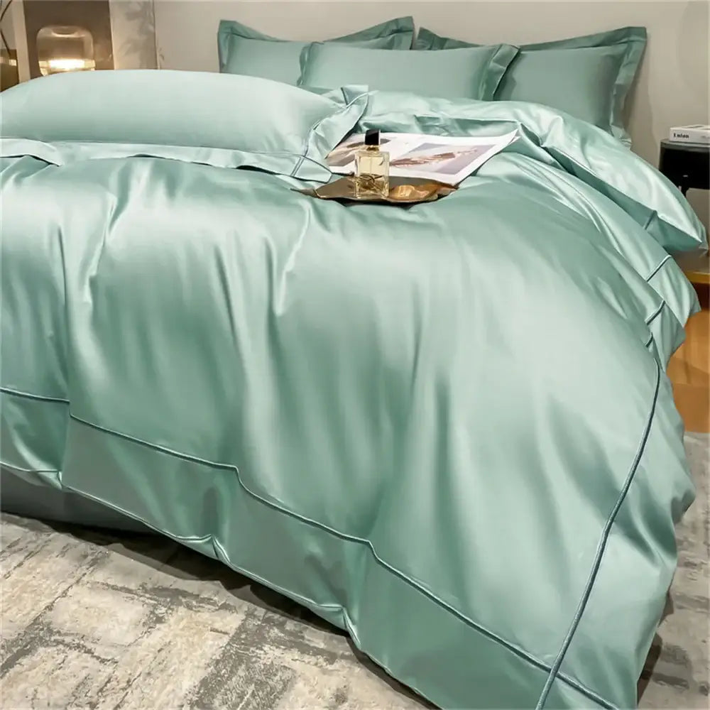 Luxurious mint green satin duvet cover with dark teal piping in DecorBites egyptian cotton bedding set