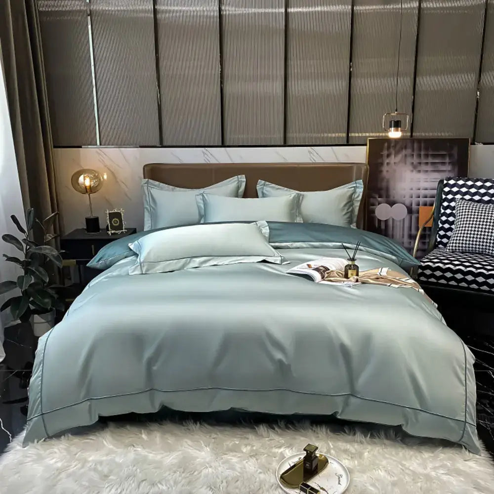 A sleek light blue satin duvet cover from DecorBites™ luxurious Svetanya Egyptian cotton bedding set with stitched detailing