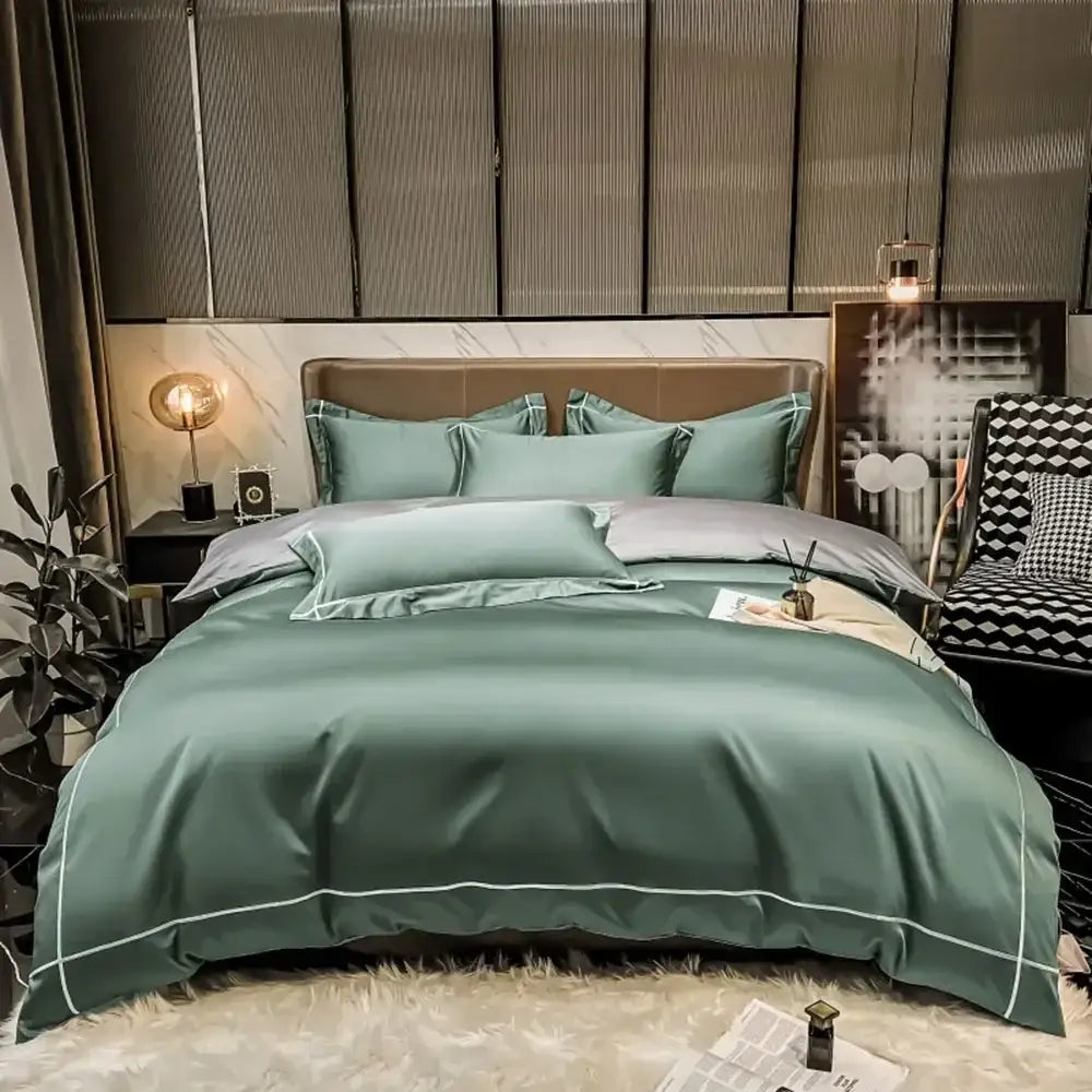 Teal satin four-piece bedding set with white piping made from egyptian cotton for a luxurious duvet cover experience