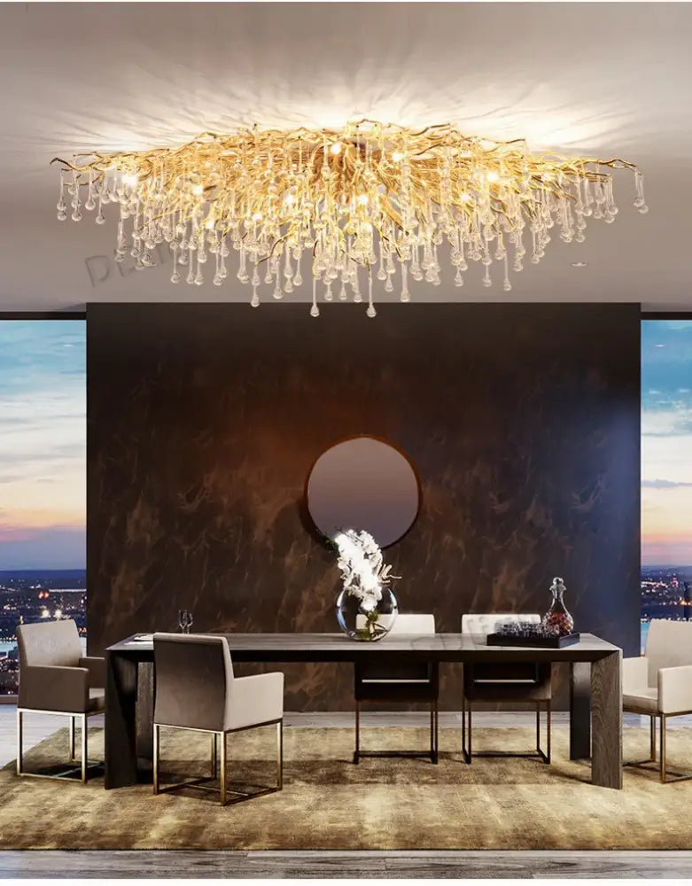 Golden branch-like luxury crystal chandelier with dangling crystal droplets from decorbites for home decor