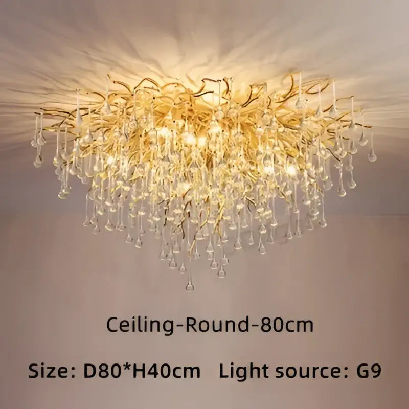 Golden branch-style luxury crystal chandelier with dangling crystal droplets for elegant home decor by decorbites