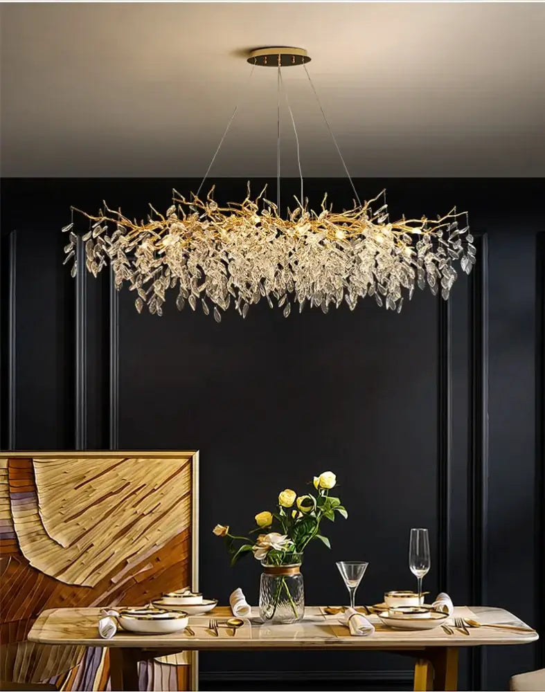 Golden branch-like decorbites luxury crystal chandelier with LED lights featuring dangling crystal leaves for living room