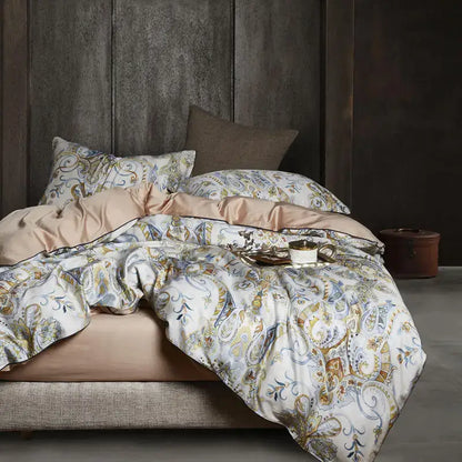 Luxurious cream-colored egyptian cotton duvet cover with gold and blue paisley patterns and satin inner lining by DecorBites™