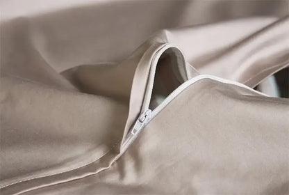 Beige satin egyptian cotton duvet cover with subtle sheen and white zipper closure from decorbites luxury bedding set