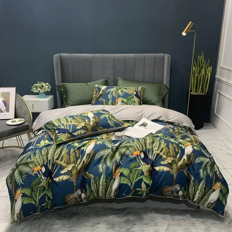 Blue tropical bird and foliage printed duvet cover set with matching pillowcases in luxury egyptian cotton by DecorBites
