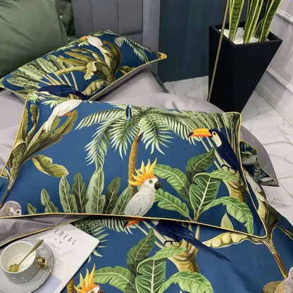 Blue tropical-themed pillow sham with vibrant foliage and parrots accented with gold trim from DecorBites Egyptian cotton bedding set