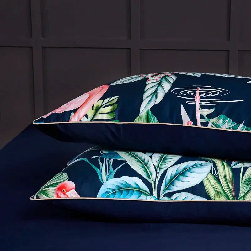 Decorbites™ luxury egyptian cotton pillowcases in dark blue with vibrant flamingo leaf tropical print and gold piping
