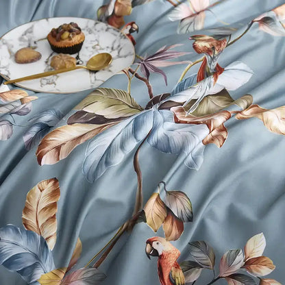 Light blue satin duvet cover and pillowcases with tropical parrot print in luxury egyptian cotton fabric