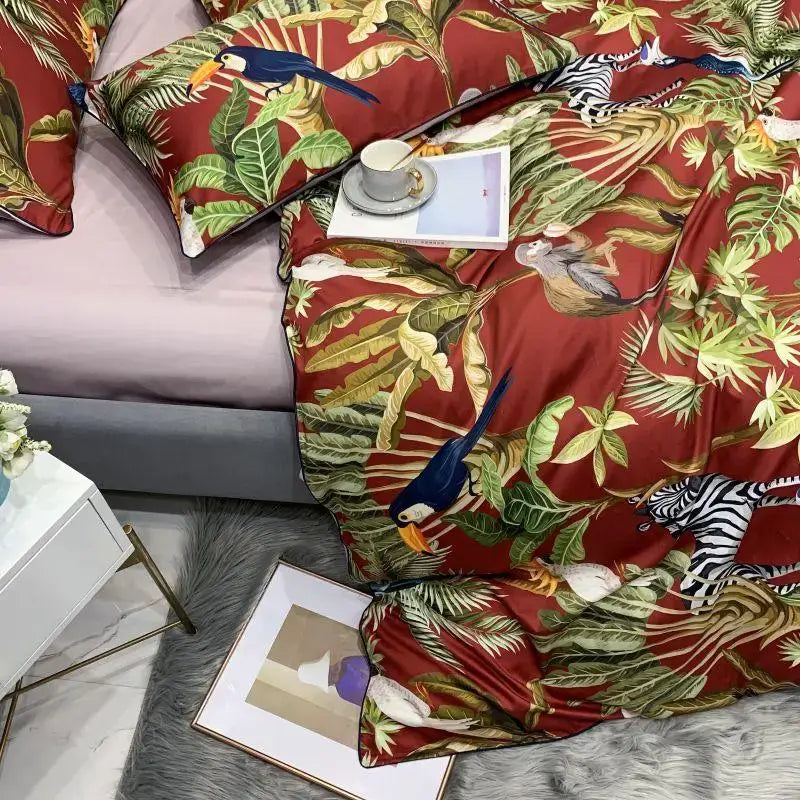 Red satin duvet cover with vibrant tropical jungle pattern featuring toucans zebras on Egyptian cotton fabric