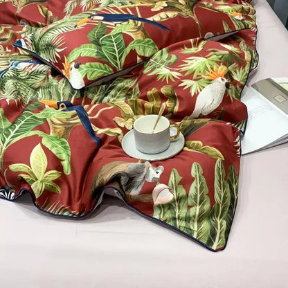 Red tropical-themed duvet cover with vibrant green leaves and birds in egyptian cotton by decorbites luxury set