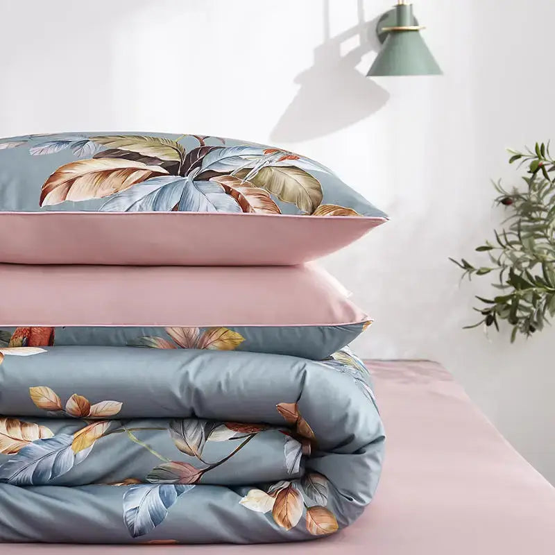 Stacked DecorBites™ luxury egyptian cotton bedding set with soft blue duvet cover and pink pieces pillowcases flamingo leaf pattern