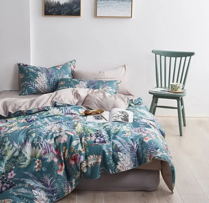 Teal and pink floral printed duvet cover and two pieces pillowcases made of satin-like egyptian cotton by decorbites luxury