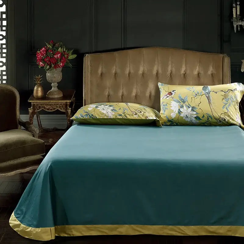 Teal satin Egyptian cotton duvet cover set with gold trim and matching floral-patterned pillowcases by decorbites