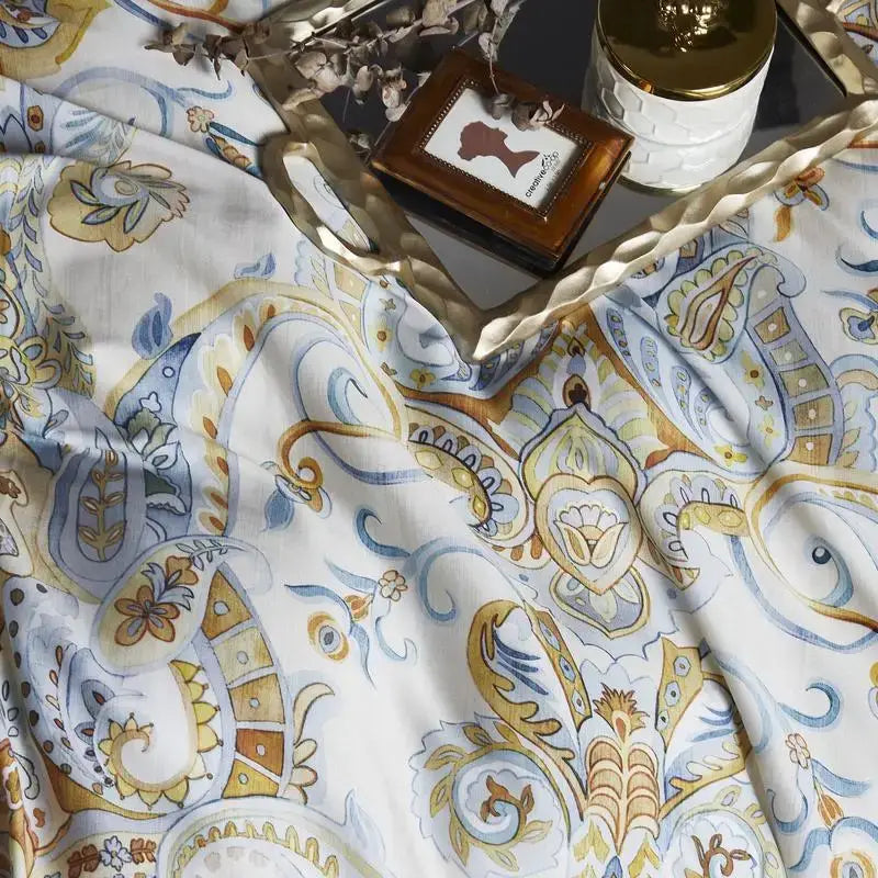 Decorbites luxury egyptian cotton duvet cover set with intricate gold blue and beige paisley patterns on white fabric