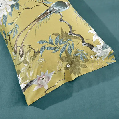 Yellow pillowcase from decorbites luxury egyptian cotton bedding set featuring elegant bird and floral pattern in muted blues whites and greens