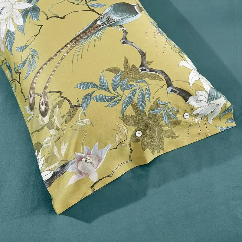 Yellow pillowcase with elegant bird and floral pattern in muted blues and greens from DecorBites™ egyptian cotton duvet cover set