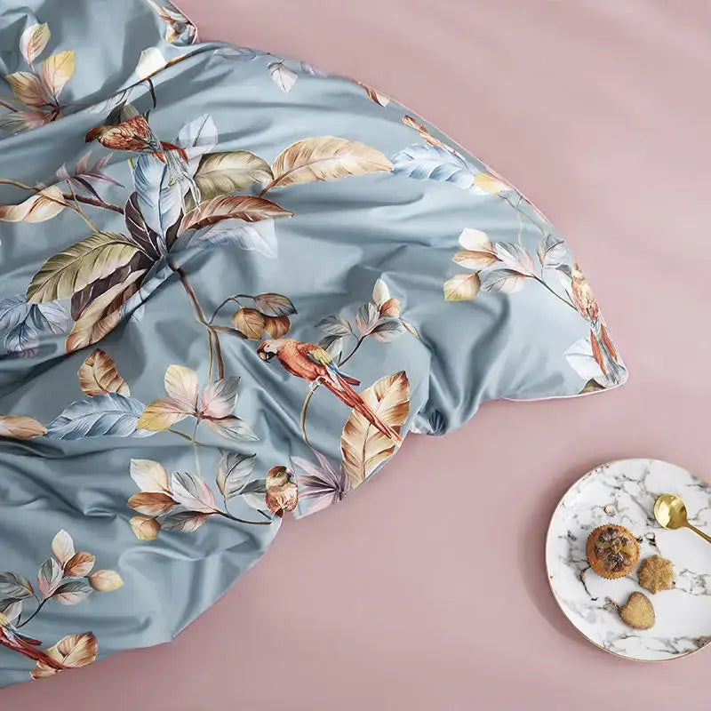 Decorbites luxury egyptian cotton duvet cover and pillowcases in light blue satin with tropical leaves and red parrot print