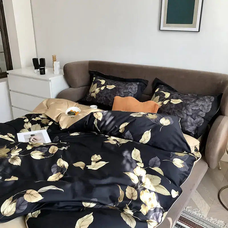 Black satin duvet cover with luxurious gold and gray leaf pattern from decorbites luxury flamingo leaf king size set