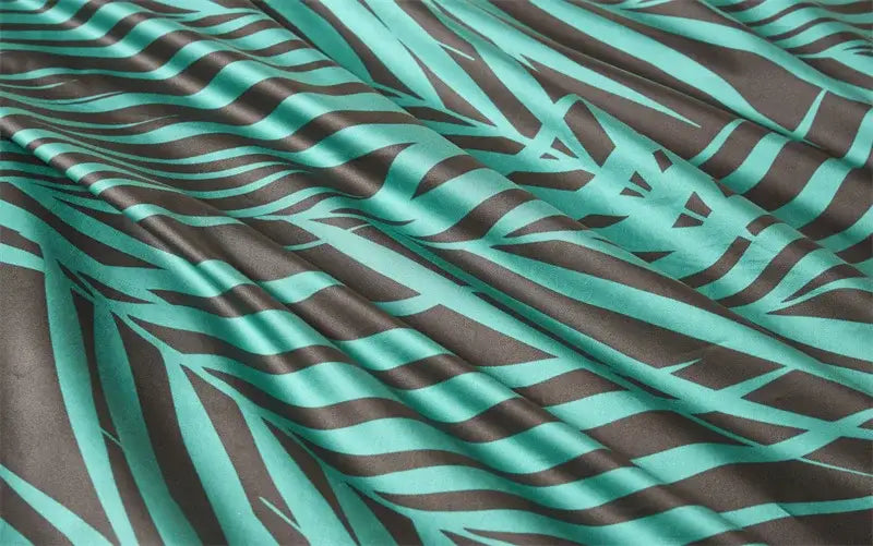 A flowing fabric with teal and dark brown zebra stripes in a glossy satin texture from decorbites luxury duvet cover set pieces pillowcases 48x74cm