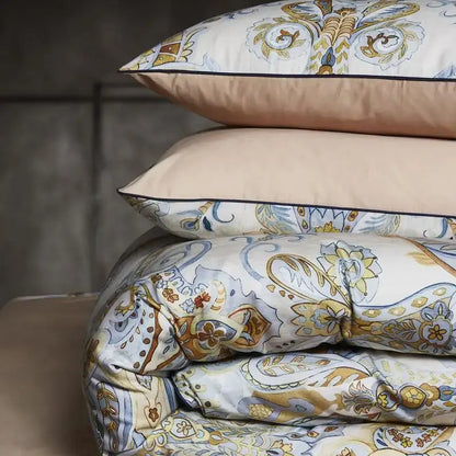 Stacked pillows and duvet cover in cream gold blue paisley pattern soft fabric from decorbites luxury flamingo leaf set queen king size