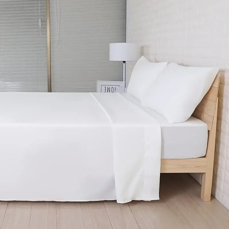 White cotton decorbites luxury hotel bed sheets set with smooth glossy finish and subtle fold lines for cooling use